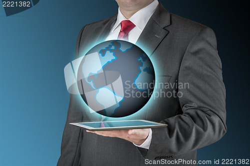 Image of Business man with tablet and earth