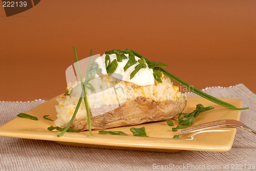 Image of Twice baked potato with chives and sour cream