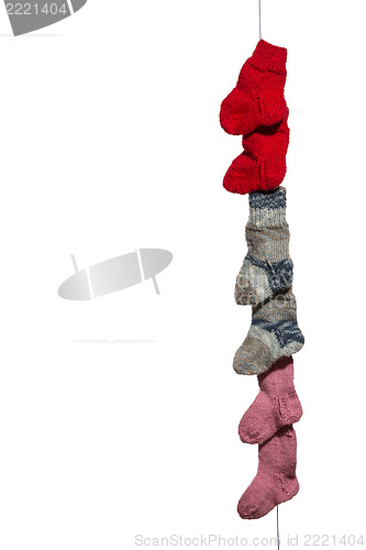 Image of Line of baby socks on white
