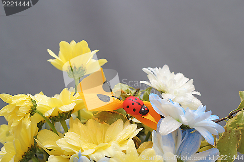 Image of flower arrangement with ladybug