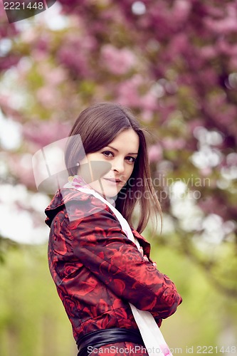 Image of Girl on a background of cherry blossoms