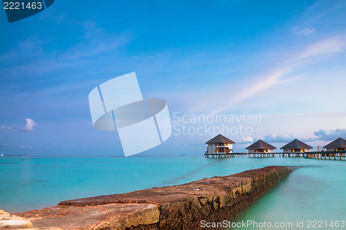 Image of tropical seascape. over-water bungalow, Maldives islands