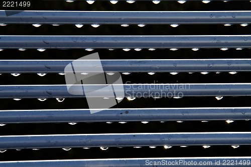 Image of water drops and steel lines