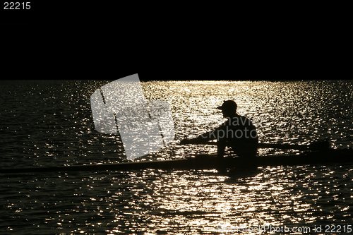 Image of Rowing alone at sunset