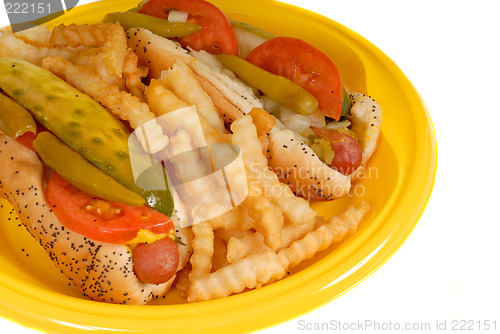 Image of Chicago style hot dogs with french fries on yellow plate