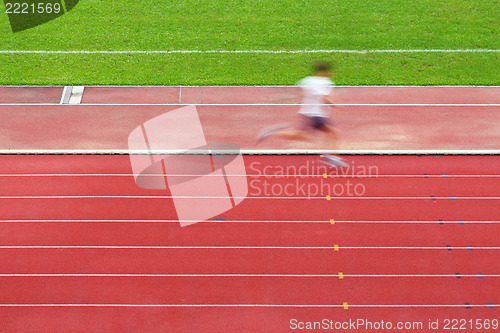 Image of Running man on tracks in sport field