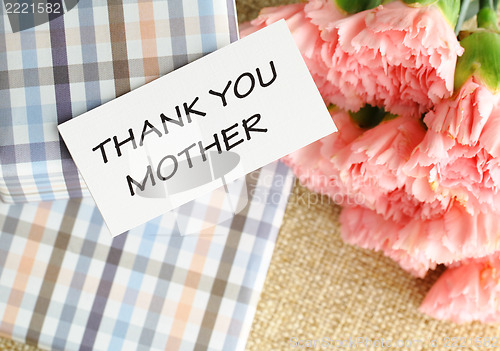 Image of Gift and pink carnations flower for Mother's Day