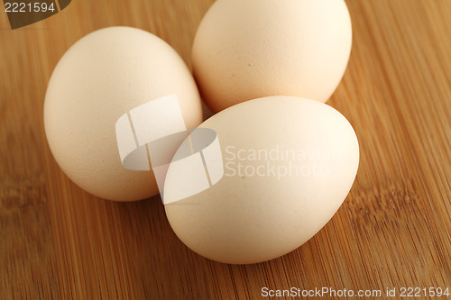 Image of eggs on wooden background