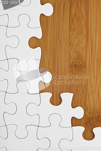 Image of Puzzle on wooden board