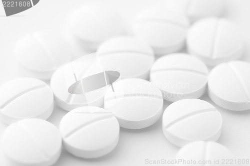 Image of White pills on white background