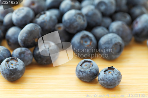 Image of blueberry on wooden background 