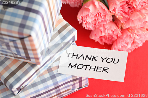 Image of Gift and pink carnations flower for Mother's Day