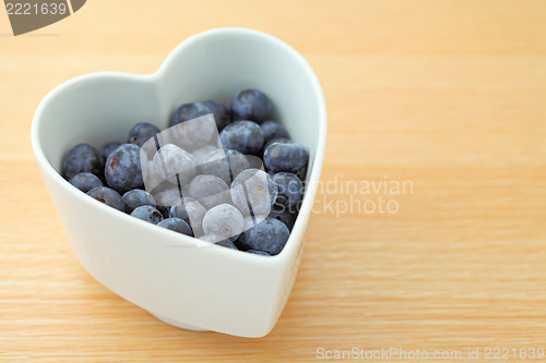 Image of blueberry on heart shape bowl 