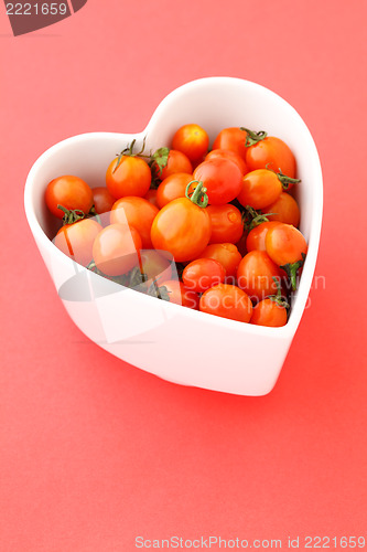 Image of cherry tomato in the heart shaped bowl 