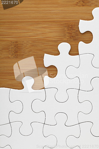 Image of Puzzle on wooden board