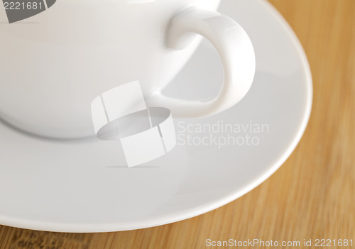 Image of wooden table with white cup