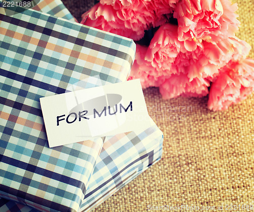 Image of Gift and pink carnations flower for Mother's Day