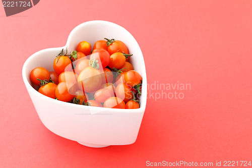 Image of cherry tomato in heart shape bowl