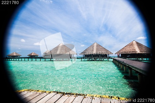 Image of Over water bungalows with steps into amazing green lagoon