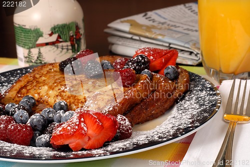 Image of Plate of french toast with fruit and maple syrup