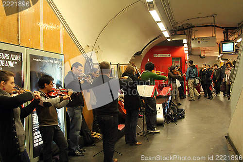 Image of The orchestra plays on the metro station in Paris