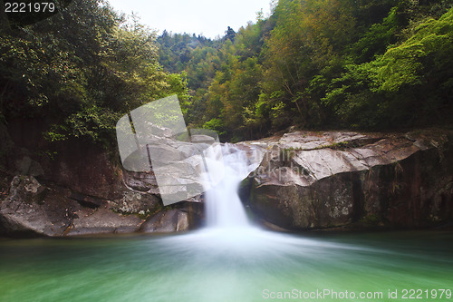 Image of Deep forest waterfall in Wuyuan, China.