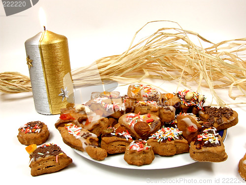 Image of Gingerbread cookies and Christmas candle