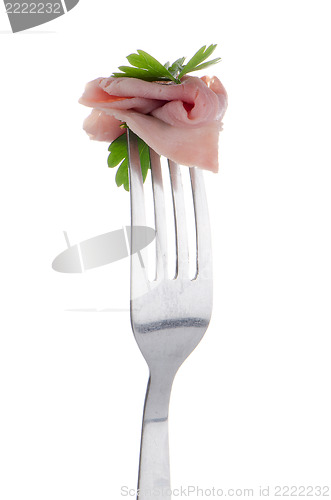 Image of Slice of ham skewered on a fork 