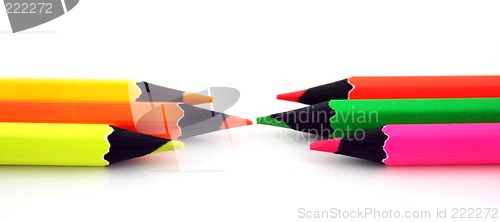 Image of Neon pencils facing each other