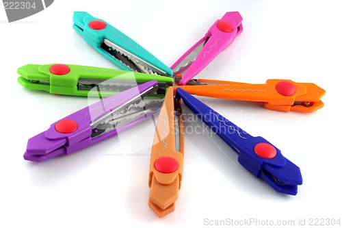 Image of Brightly colors craft scissors on a white background