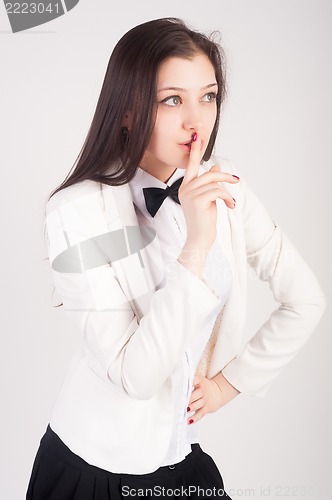 Image of Woman gesturing to silence