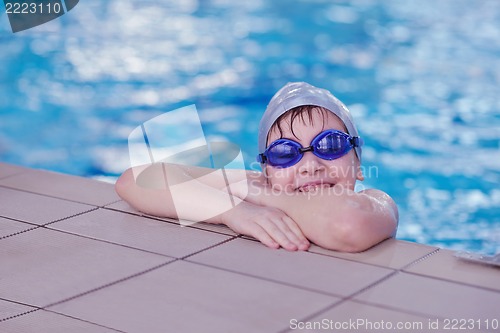 Image of happy child on swimming pool