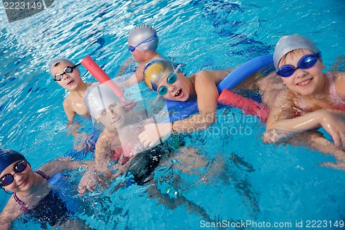 Image of happy children group  at swimming pool