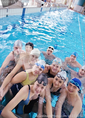 Image of happy teen group  at swimming pool