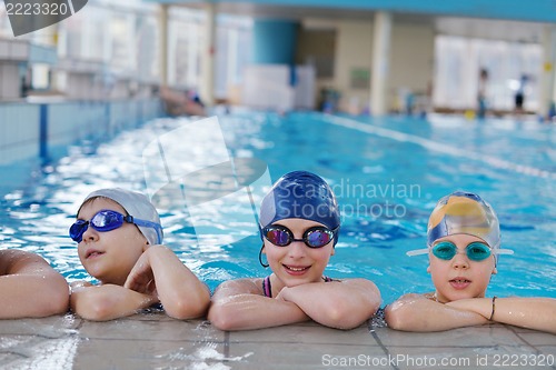 Image of happy children group  at swimming pool