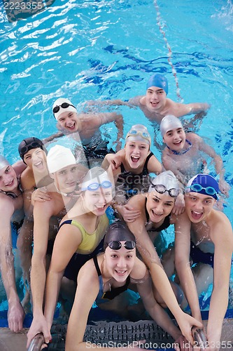 Image of happy teen group  at swimming pool