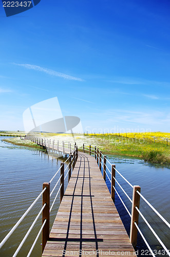 Image of Wooden bridge into the lake of Alqueva , Portugal