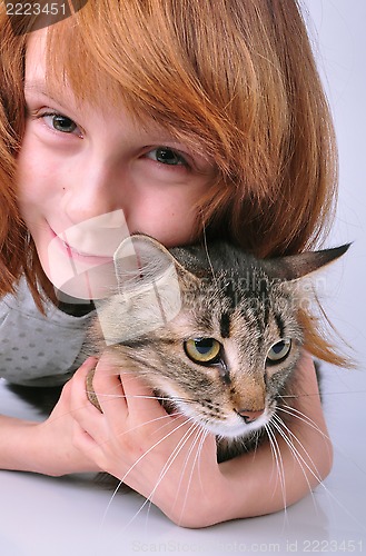 Image of little girl communicating with her pet