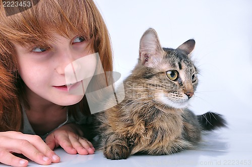 Image of child and cat looking with surprise