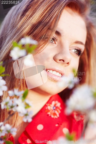 Image of Girl in the flowers of cherry