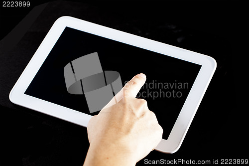 Image of Human hand using blank touch screen device