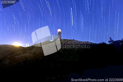 Image of Mountain silhouette with a blue background at night with startra