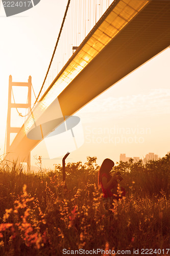 Image of Female photographer under sunshine