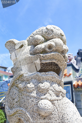 Image of Lion statue outside a temple