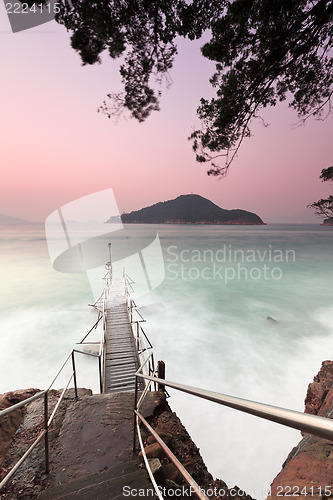 Image of Sunset pier with strong wave motion