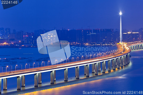 Image of Freeway in night with cars light in modern city