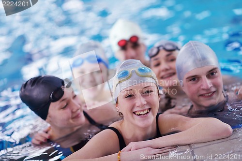 Image of happy teen group  at swimming pool