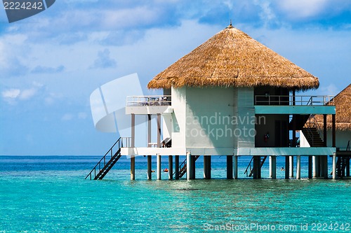 Image of Over water bungalows with steps into amazing green lagoon
