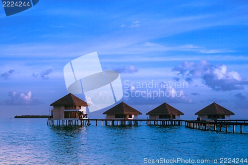 Image of Over water bungalows with steps into amazing green lagoon