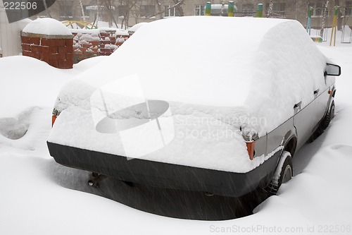 Image of Snow covered car